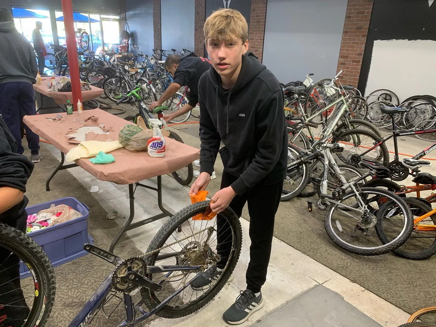 Bicycle repair work at the December 2022 adopt-a-family event